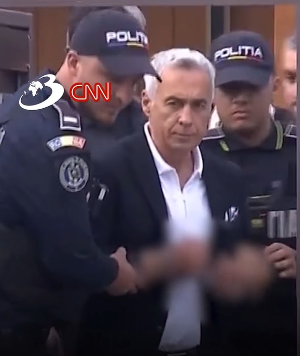 Călin Georgescu a fost arestat pentru 30 de zile, fiind scos cu cătușe din locuința sa din Mogoșoaia. Inițial, cei doi judecători ai Curții de Apel nu s-au înțeles asupra unei soluții, așa că un al treilea a tranșat decizia, care este definitivă. Alături de Georgescu va fi arestat și afaceristul Ionel Rusen. Ambii sunt suspectați că l-au înșelat cu 1,1 milioane de euro pe un om de afaceri de la Buzău, căruia îi promiseseră facilitarea unor credite din afara țării.